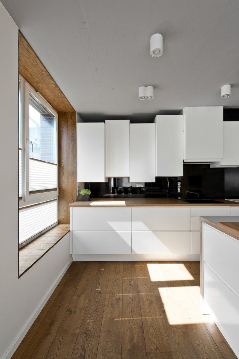 Mobilier scandinave en gris, blanc et bois d'un loft nordique