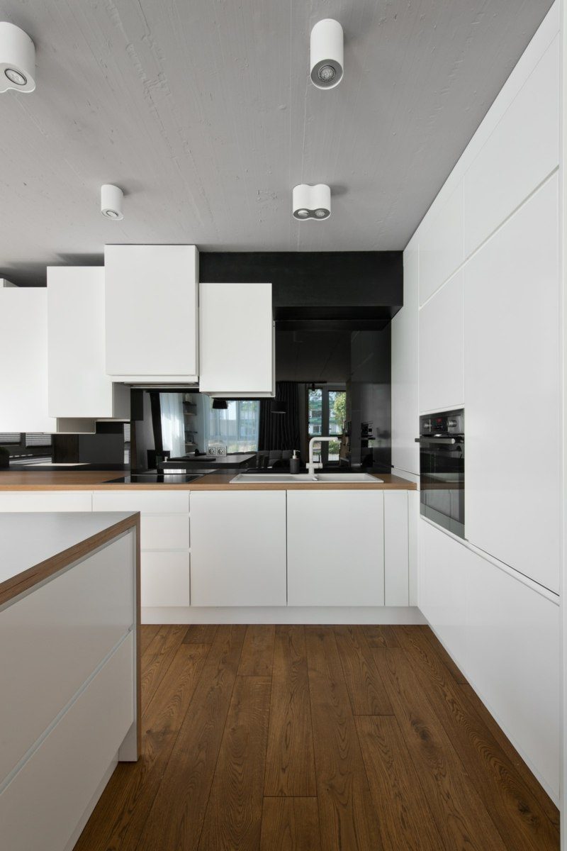 Mobilier scandinave en gris, blanc et bois d'un loft nordique