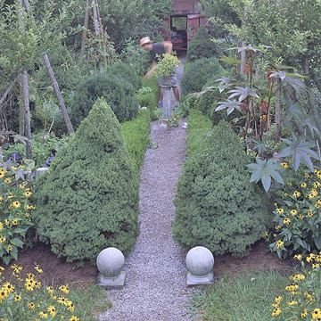 allée-de-jardin-végétation-abondante-éléments-déco