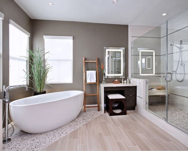salle-de-bain-moderne-baignoire-ovale-paroi-transparent-coiffeuse