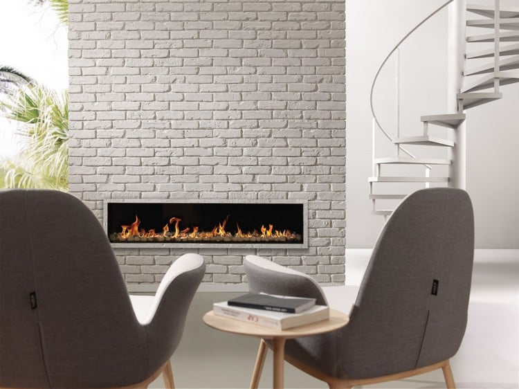 brique de parement - blanche-habillage-cheminee-fauteuils-gris-bois
