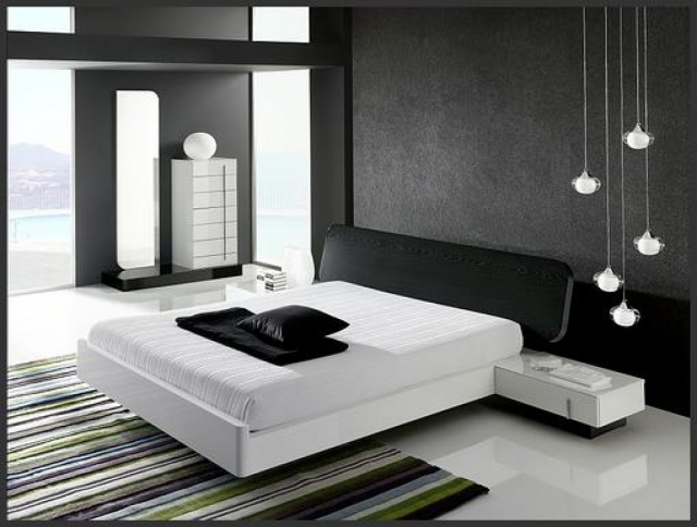 déco-moderne-noir-blanc-grand-lit-coussins-noirs-table-nuit