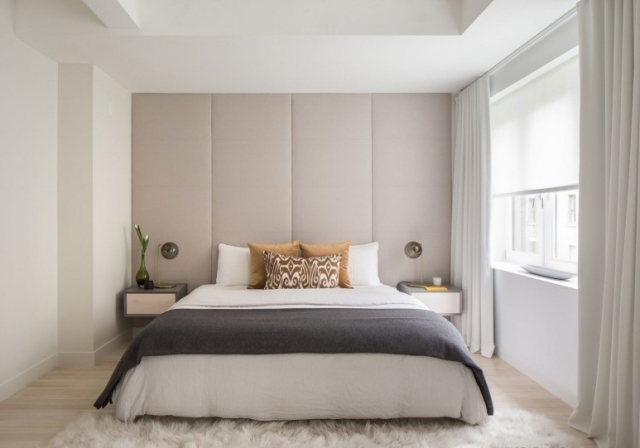 chambre-coucher-moderne-blanche-élégante-accents-gris-coussins-élégants chambre à coucher contemporaine