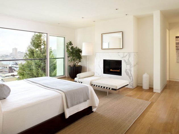 chambre-coucher-moderne-cheminée-blanche-grand-mit-tapis-beige