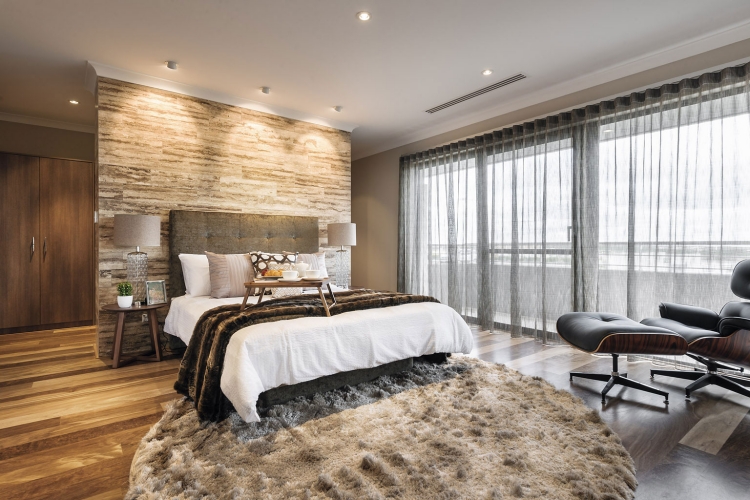 chambre-coucher-moderne-tapis-rond-gris-clair-tpete-lit-tapissée-couverture-fourrure-lampes-chevet-fauteuil-relax-cuir-noir chambre à coucher contemporaine