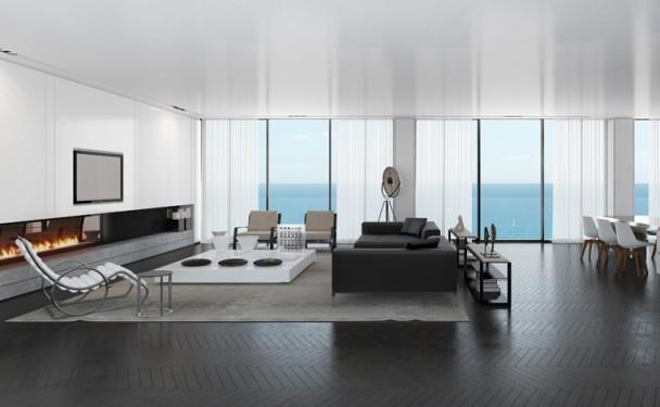 salon-style-minimaliste-canapé-noir-cheminée-chaise-longue