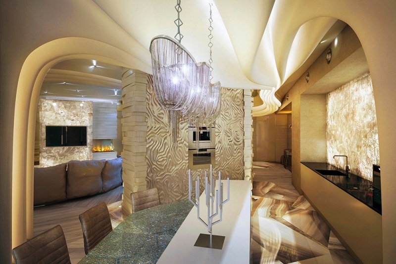 interieur-design-moderne-cuisine-îlot-lustre-chaises-cuir