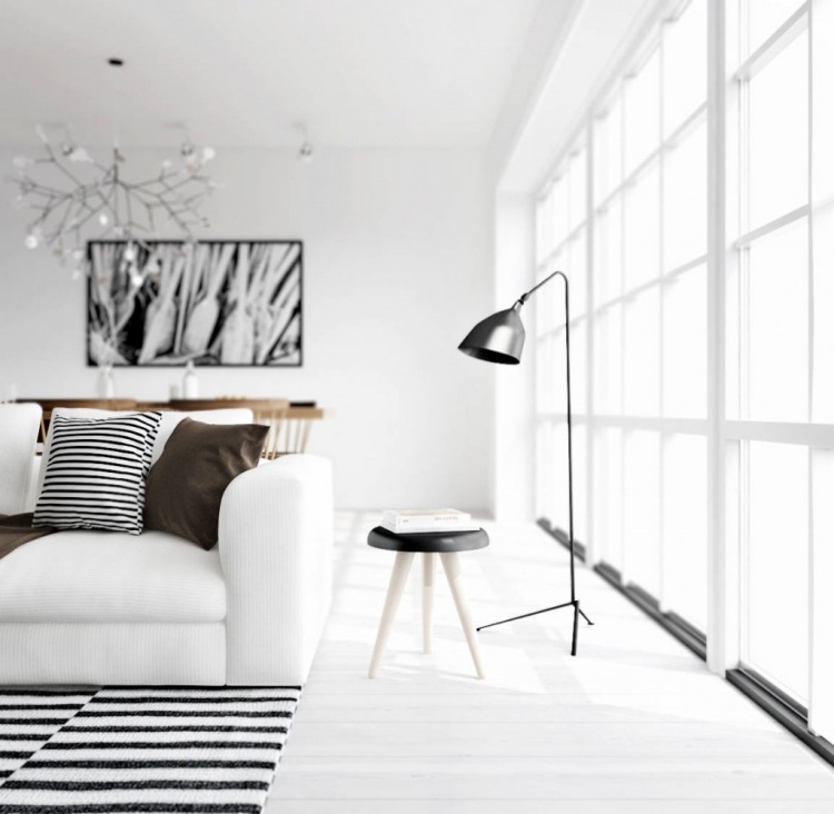 meuble-salon-blanc-peinture-murale-canapé-sol-résine-accents-noirs mobilier de salon