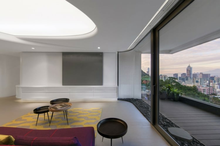 éclairage plafond  tapis-jaune-gris-table-basse-rond-canape-droit