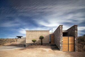 extérieur maison écologique pisé pierre naturelle bois béton