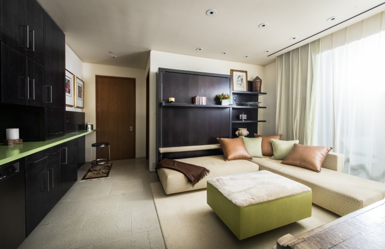 interieur-maison-luxe-salle-séjour-canapé-angle-ottoman-meuble-rangement-noir-vert-anis intérieur maison de luxe