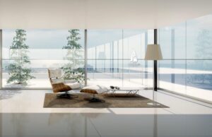 deco-salon-blanc-fauteuil-relax-repose-pieds-tapis-marron