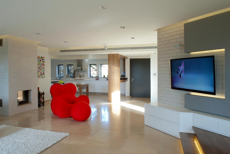interieur-minimaliste-mur-brique-blanche-fauteuil-rouge-accent minimaliste