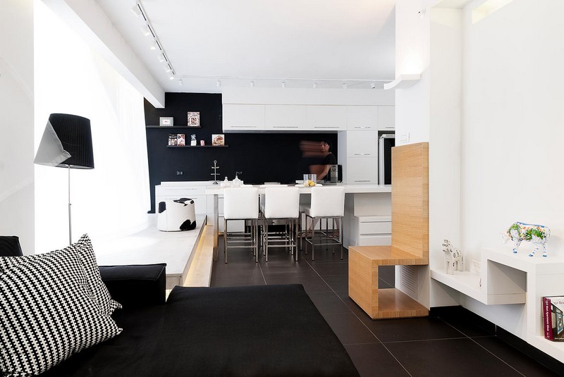interieur-minimaliste-peinture-murale-blanche-salle-séjour-canapé-noir-cuisine-blanche intérieur minimaliste