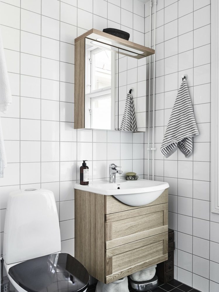 intérieur-scandinave-salle-bains-carreaux-blancs-meuble-vasque-bois-tiroirs-serviette-rayures intérieur scandinave