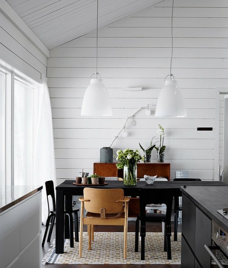 intérieur-scandinave-salle-manger-lambris-mural-blanc-table-chaises-bois-suspensions-blanches intérieur scandinave