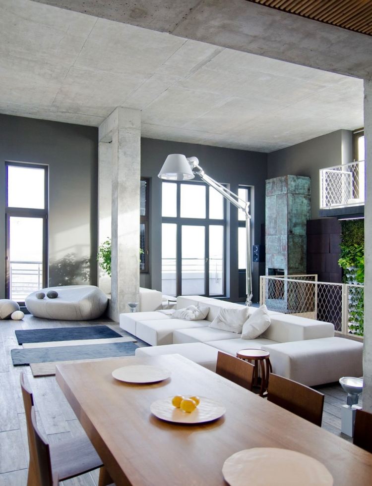 mobilier-industriel-murs-plafond-béton-table-manger-bois-canapé-blanc-cheminée-habillage