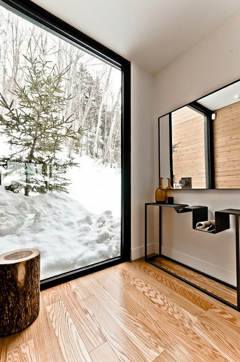 tendances-design-interieur-revêtement-sol-bois-fenêtre-panoramique-table-tronc-arbre-miroir