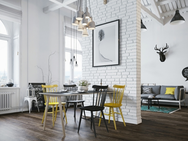 amenagement-studio-style-scandinave-mur-brique-blanche-table-blanche-chaises-couleurs-suspensions aménagement studio