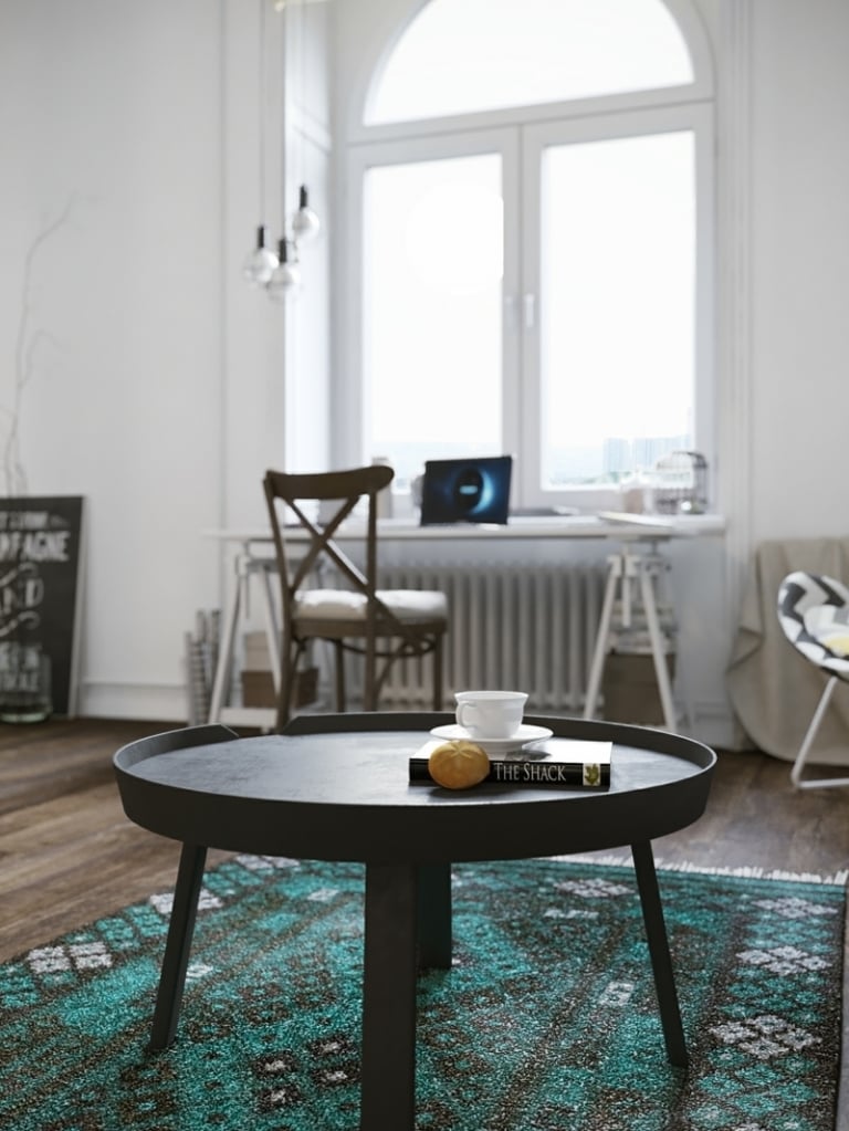 amenagement-studio-style-scandinave-table-basse-noire-tapis-turquoise aménagement studio