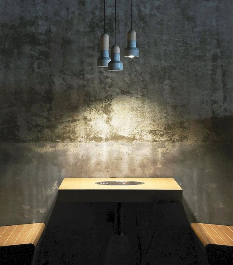 mobilier-beton-mur-béton-brut-table-bancs-fixatio-murale-buntu-design mobilier béton