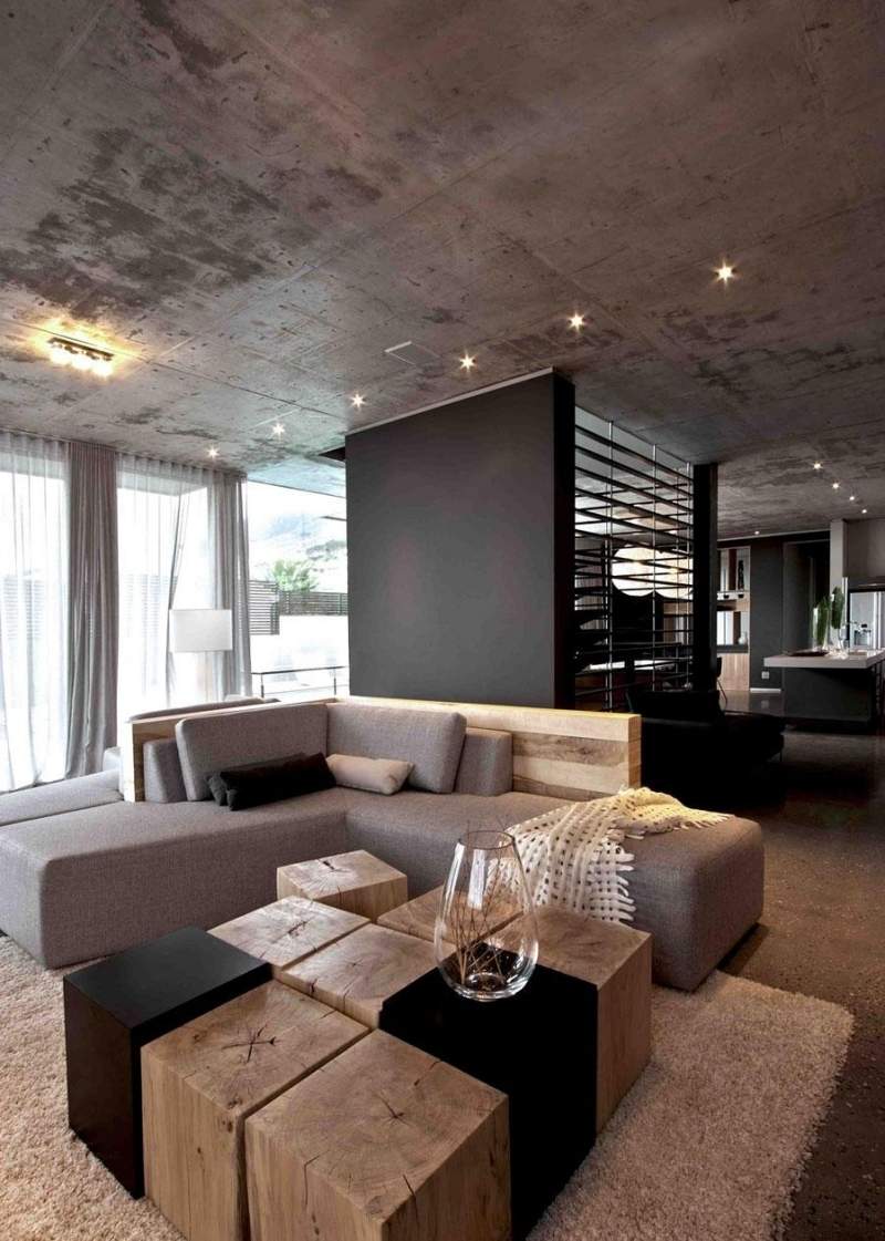mobilier-beton-plafond-béton-canapé-rebourré-gris-clair-table-basse-bois-massif mobilier béton