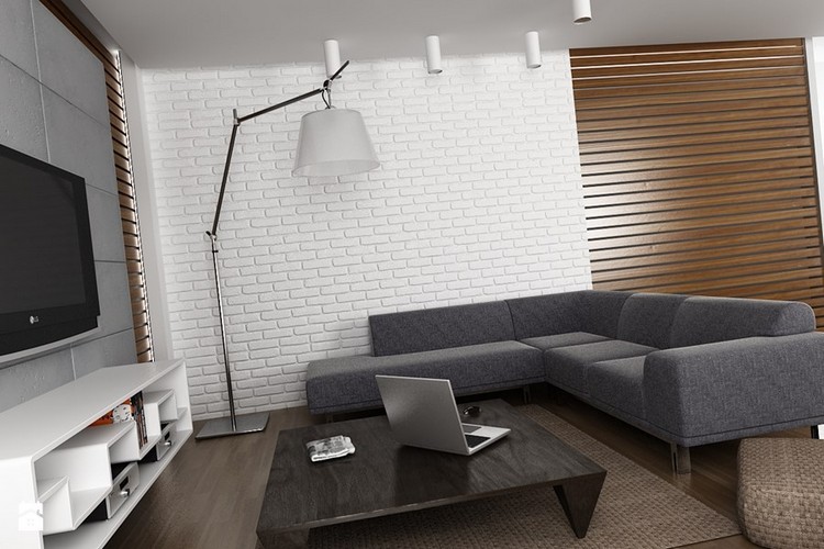 canapé-gris-chiné canapé angle revêtement mural brique blanche lampadaire-design