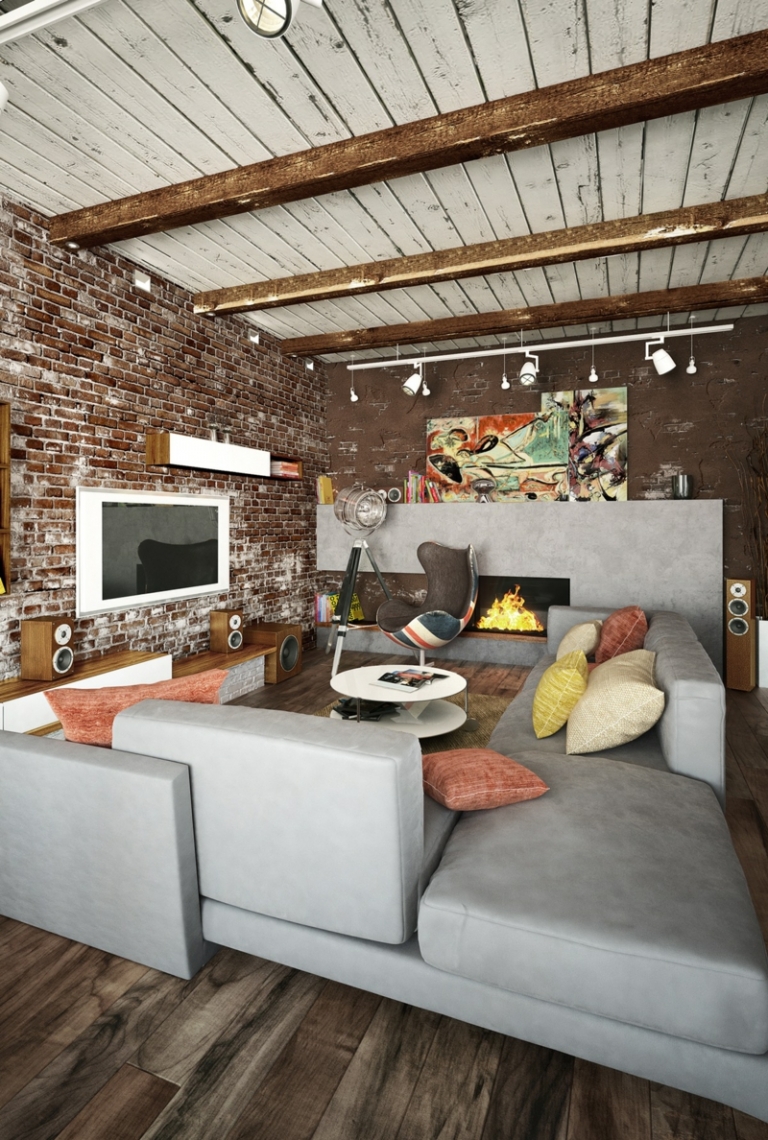 deco-loft-canapé-gris-clair-mur-brique-plafond-poutres-coussins-cheminée-fauteuil déco loft