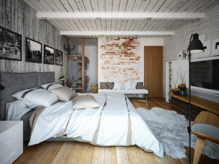 deco-loft-chambre-coucher-mur-brique-banc-blanc-photos-noir-blanc-tapis-shaggy-gris déco loft