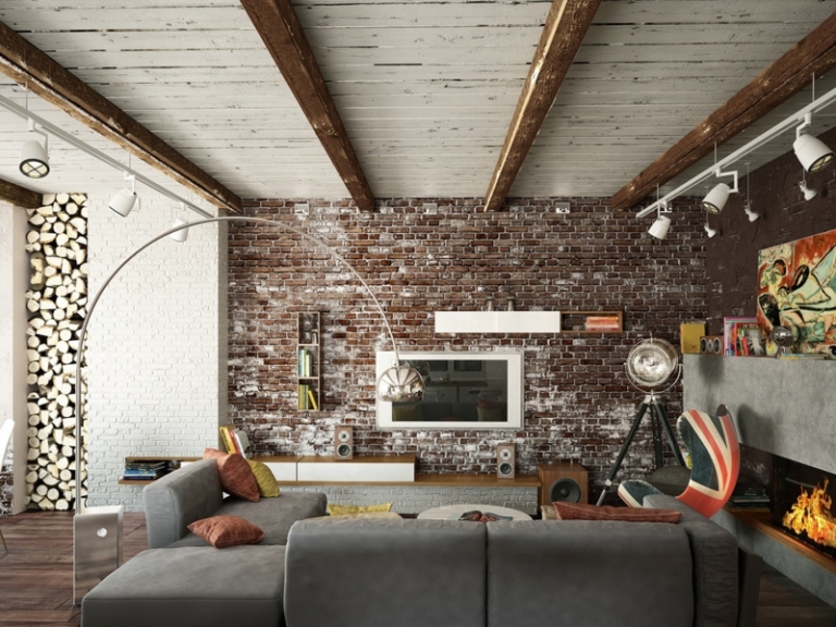 deco-loft-mur-brique-canapé-gris-cheminée-béton-rangement-bois