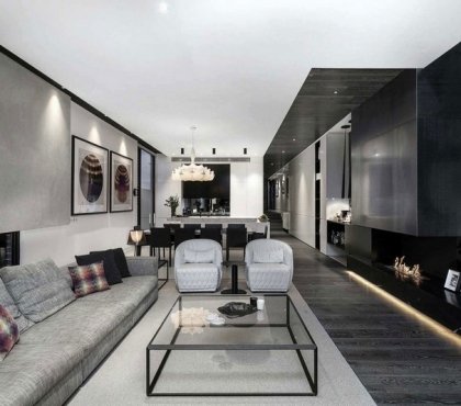 deco-noir-blanc-canapé-tapis-gris-fauteuils-blancs-mur-aspect-béton-peinture-murale-noire