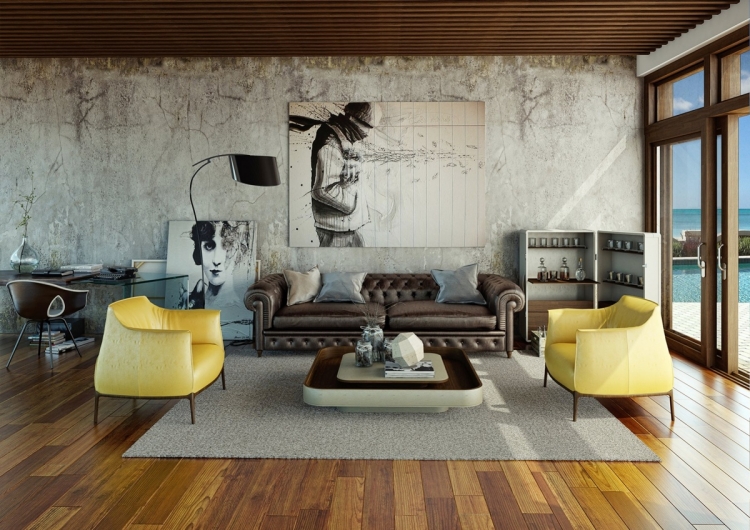 deco-salon-moderne-canapé-chesterfield-cuir-marron-fauteuils-jaunes-mur-béton déco salon moderne