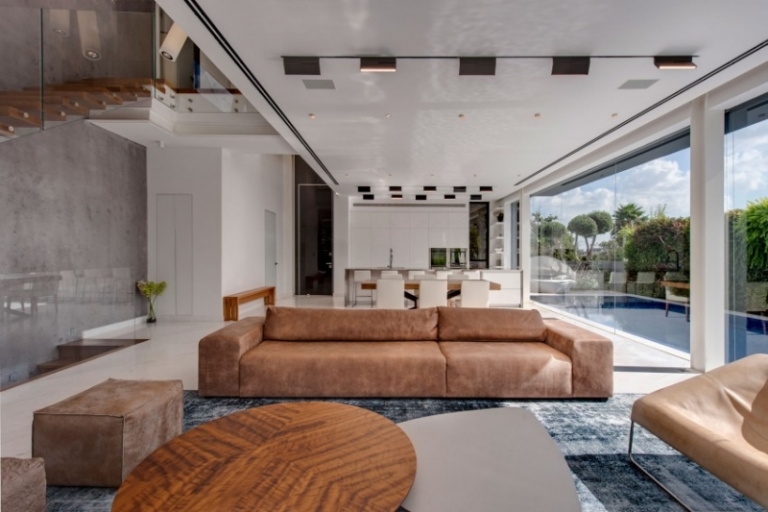 interieur-design-moderne-table-basse-ronde-canape-droit-ottoman-tapis-couleur-grise