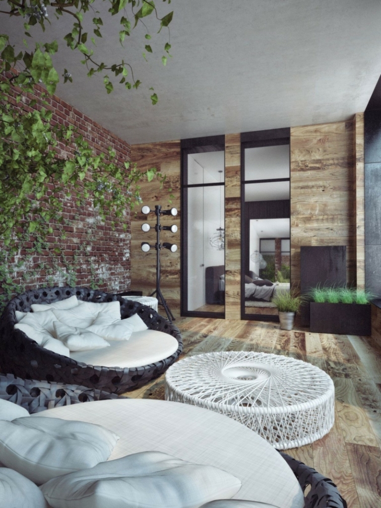 mur-briques-balcon-penthouse-lit-jour-rond-table-ronde-blanche-plantes-vertes-porte-coulissante