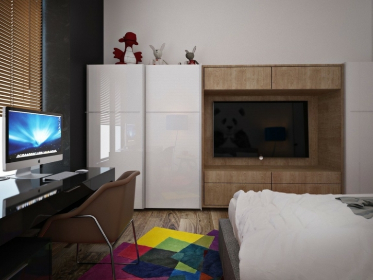 mur-briques-chambre-enfant-tapis-bariolé-tv-écran-plat-stores-meuble-bureau-noir