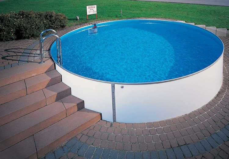 construire sa piscine sol-ronde-pavés-marches-pierre