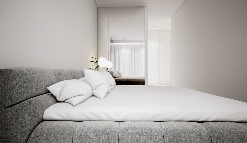 intérieur-blanc-petite-chambre-coucher-lit-tapissé-tissu-gris