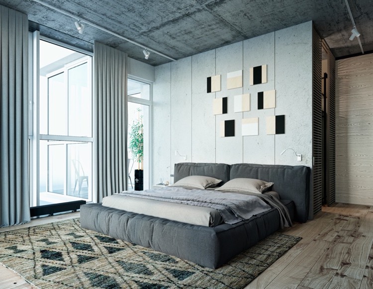 chambre grise -industrielle-plafond-béton-lit-rembourré-gris-tapis-marron-plancher-bois
