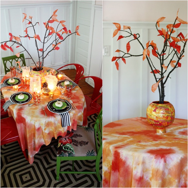 décoration table automne -nappe-bariolée-branchage-feuilles-rouges-citrouilles-blanches