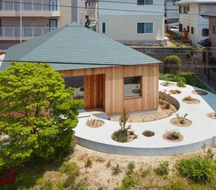 jardin original circulaire-béton-parterres-ronds-maison-bois-japon