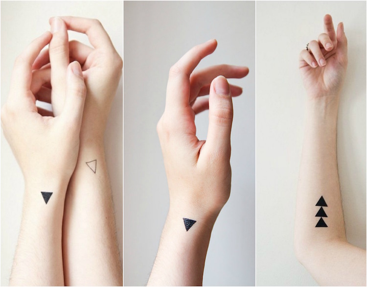 tatouage-géométrique-femme-triangles-noirs-vides-poignet-avant-bras