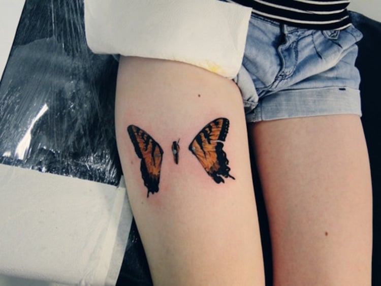 tatouage-papillon-femme-jambe