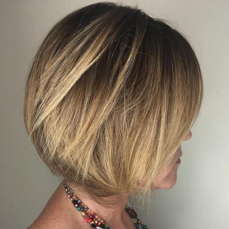 50-year-old woman haircut highlights blonde plunging box