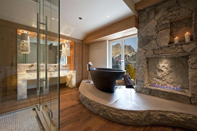 salle de bain en pierre naturelle cheminée et bois massif