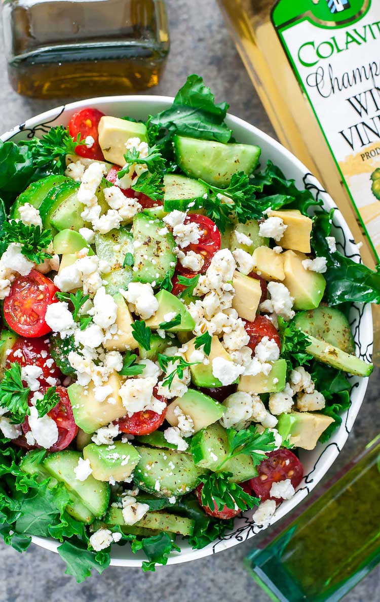 Greek green salad recipe with cabbage, cucumbers, cherry tomatoes, avocado, feta cheese