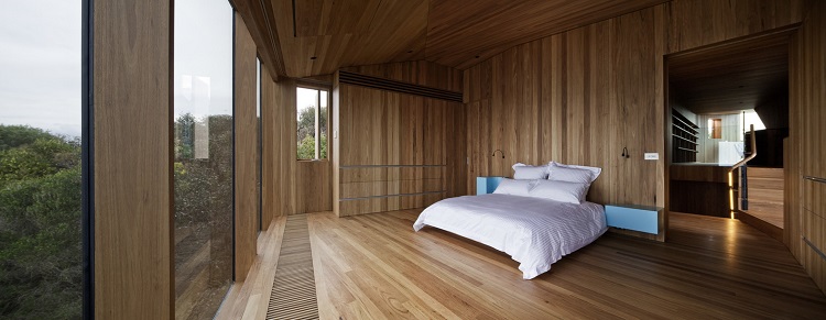 habillage bois intérieur chambre à coucher vue panoramique meuble intégré