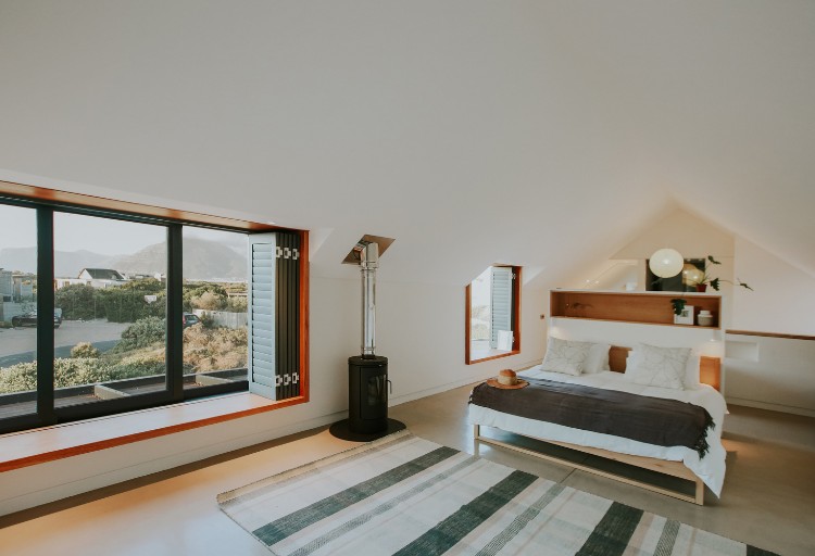mur en pierre apparente ambiance contemporaine maison architecte sud africaine chambre coucher cosy