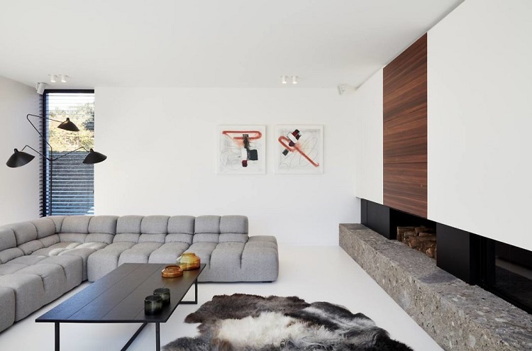 meuble sans poignée intérieur moderne salon cosy cheminée canapé gris