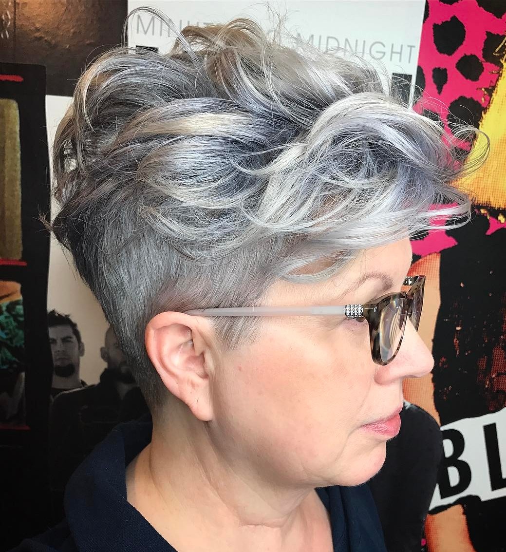 Hairstyle for a 50-year-old woman with shaving glasses on the sides is a modern cut
