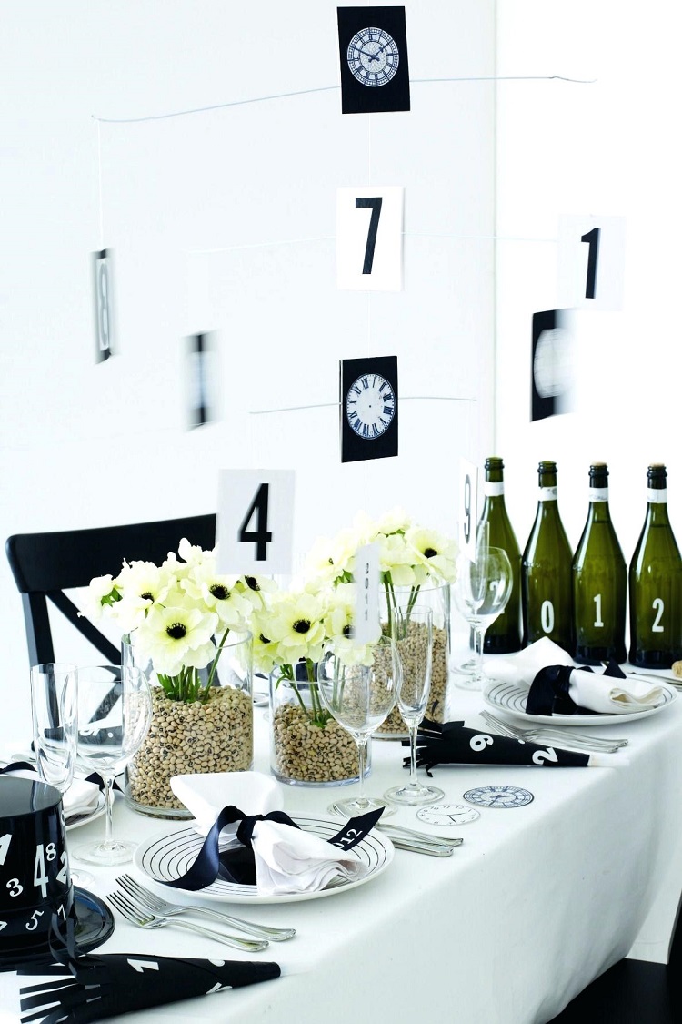 idées DIY centre de table nouvel an vases graviers fleurs déco noir et blanc